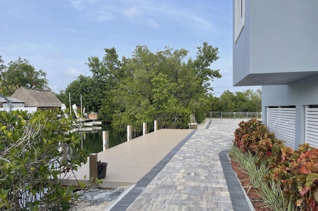 exterior space with a boat dock and a water view