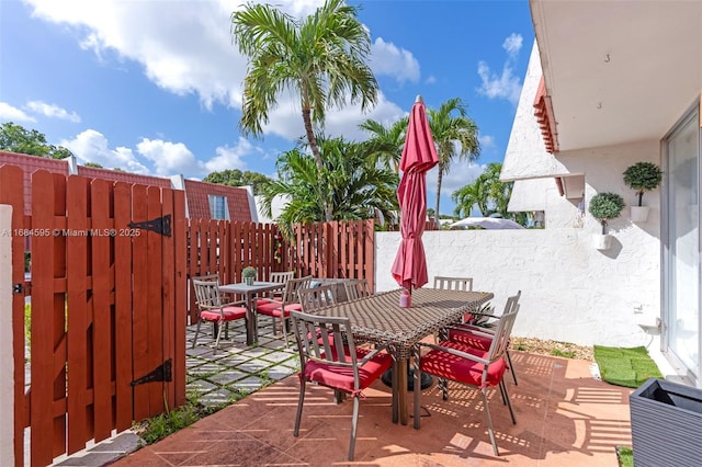 view of patio / terrace with outdoor dining space and fence