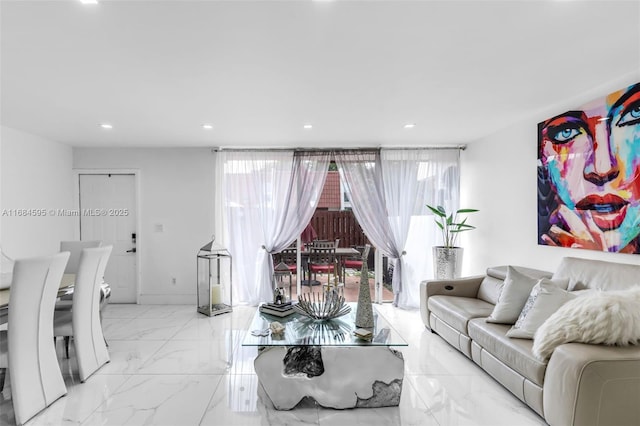 living room with marble finish floor, recessed lighting, and a wealth of natural light