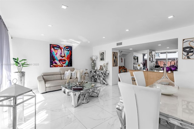living room with marble finish floor, visible vents, and recessed lighting