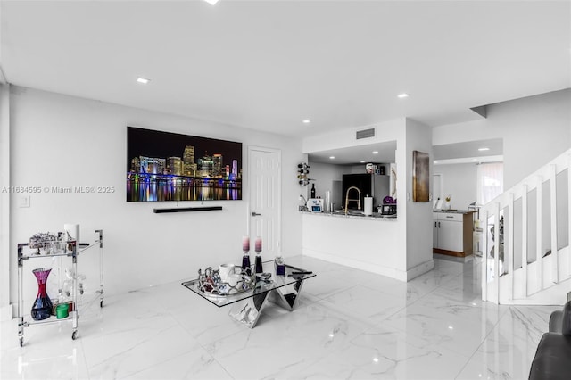 interior space featuring visible vents, baseboards, recessed lighting, stairs, and marble finish floor