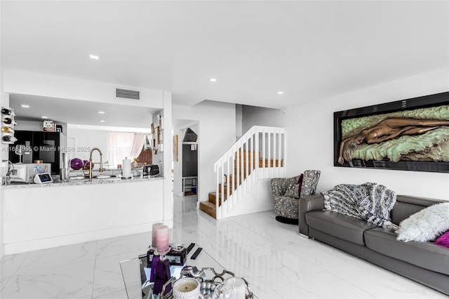 living area with visible vents, stairway, marble finish floor, and recessed lighting