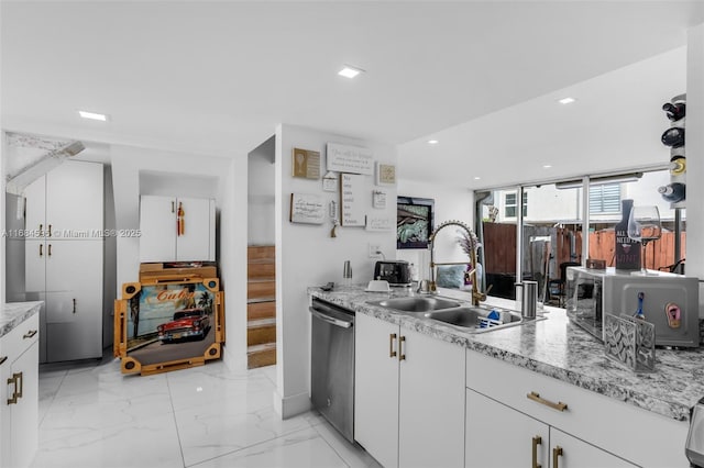 kitchen featuring white cabinets, dishwasher, a sink, recessed lighting, and marble finish floor