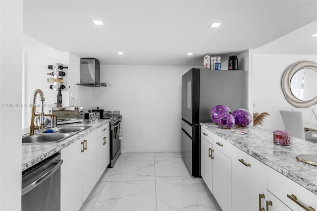 kitchen with wall chimney range hood, marble finish floor, light countertops, a sink, and stainless steel appliances
