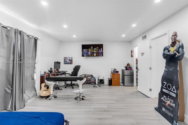 office area featuring recessed lighting, visible vents, and wood finished floors