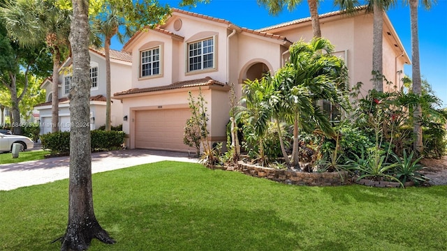 mediterranean / spanish-style house with a front yard and a garage