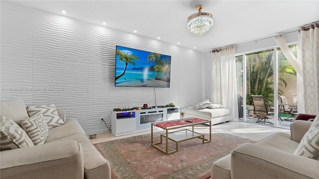 tiled living room featuring an inviting chandelier