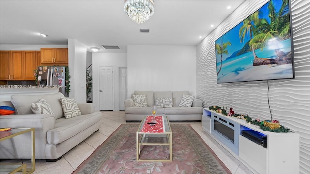 tiled living room with an inviting chandelier