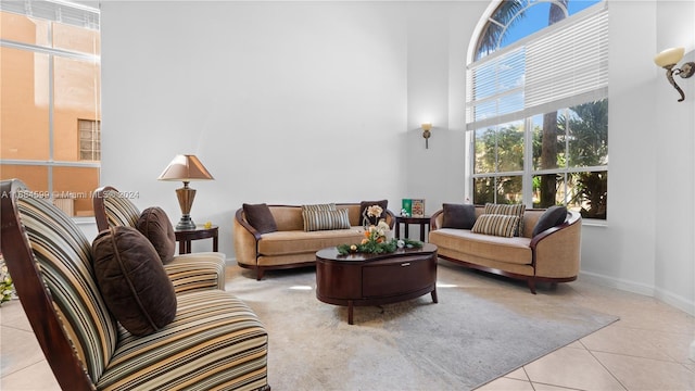 tiled living room with a high ceiling