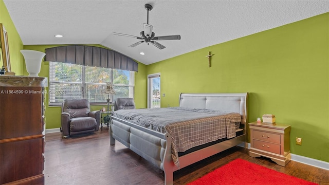 bedroom featuring a textured ceiling, dark hardwood / wood-style floors, vaulted ceiling, and ceiling fan