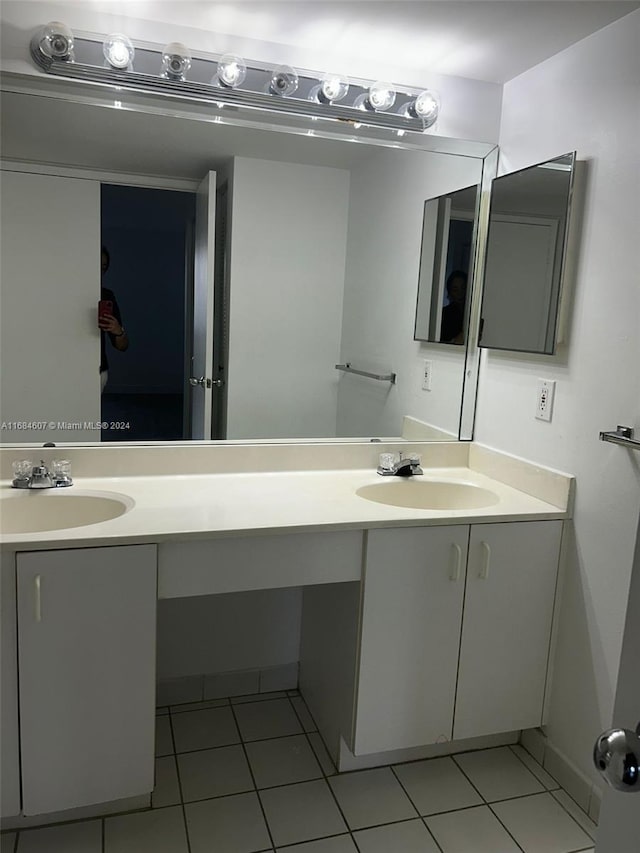 bathroom with tile patterned flooring and vanity