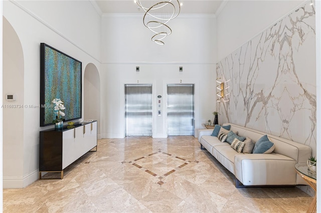 interior space featuring crown molding, tile walls, elevator, and a high ceiling