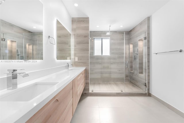 bathroom with vanity, tile patterned floors, and walk in shower