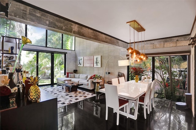 dining area featuring a high ceiling