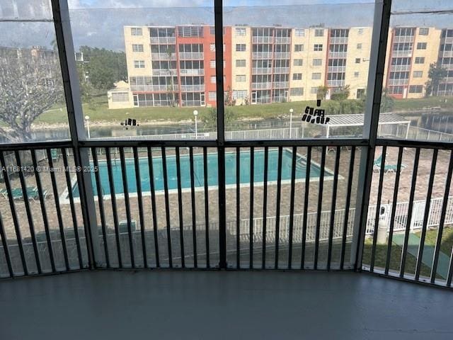 view of pool with a water view