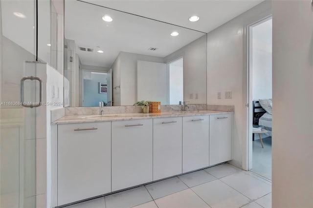 bathroom with vanity, tile patterned floors, and an enclosed shower