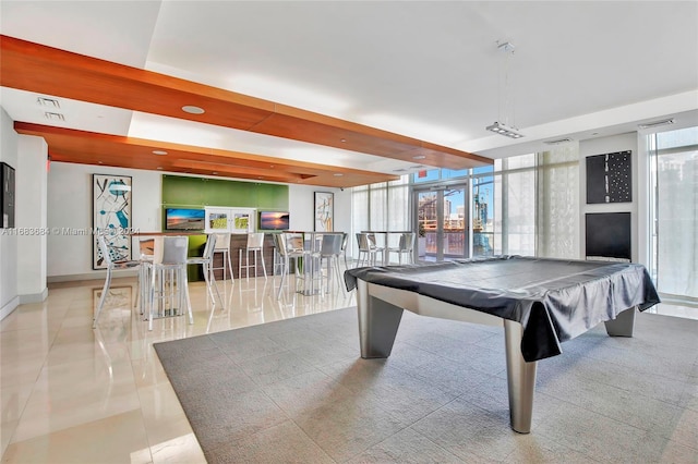 playroom with light tile patterned floors, pool table, and floor to ceiling windows