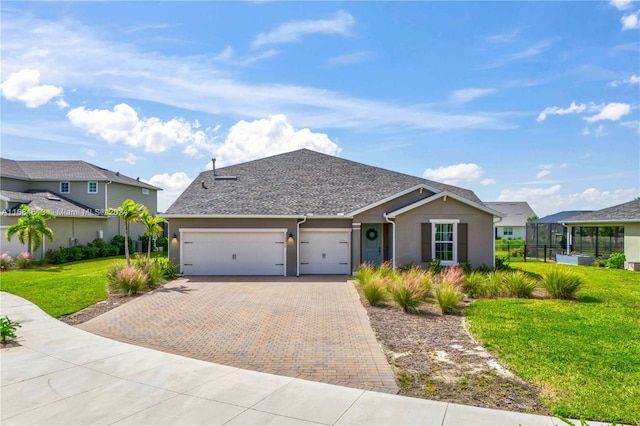 view of front of home featuring a garage and a front yard