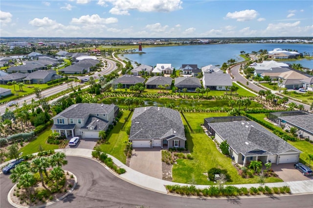 birds eye view of property with a water view