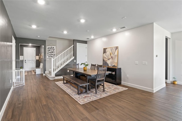 dining area with dark hardwood / wood-style floors