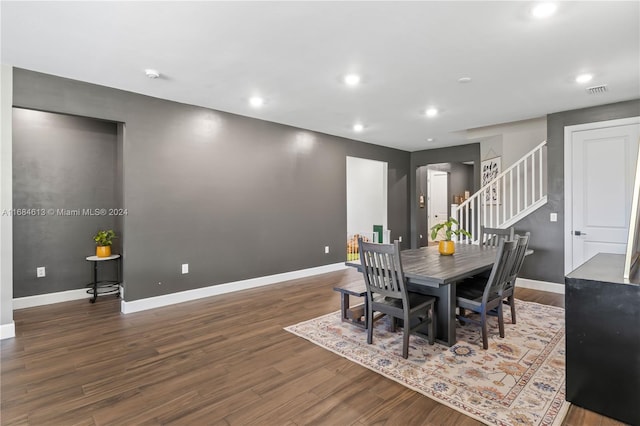 dining space with dark hardwood / wood-style floors