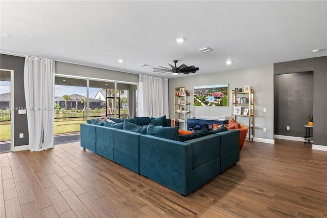 living room featuring hardwood / wood-style flooring and ceiling fan