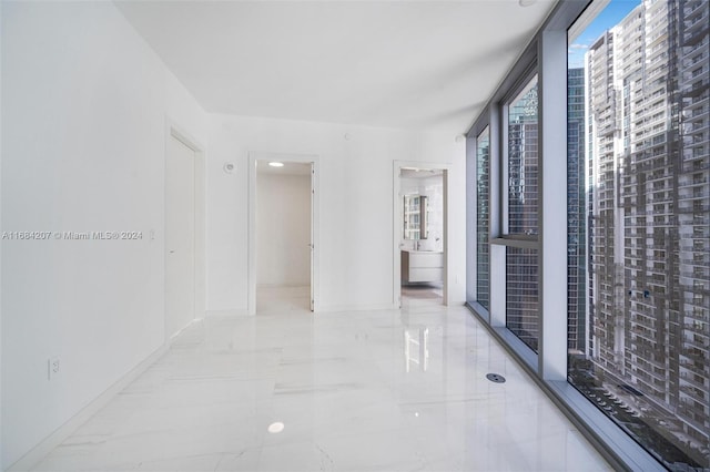 300 Biscayne Blvd Way Unit 2501, Miami, FL 33131 - corridor featuring marble tiled flooring and baseboards