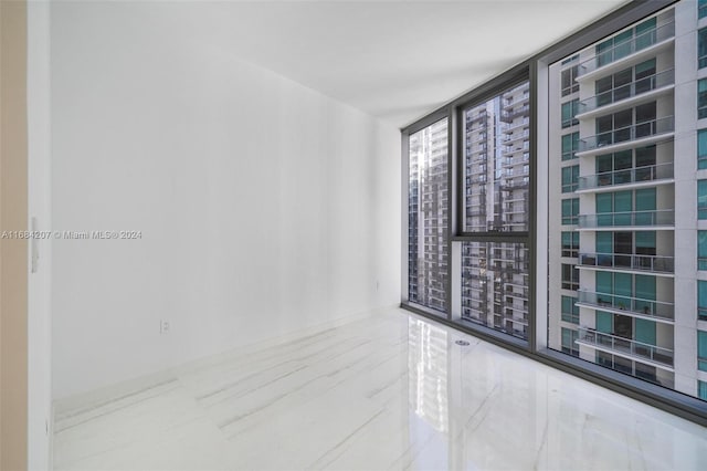 spare room featuring expansive windows