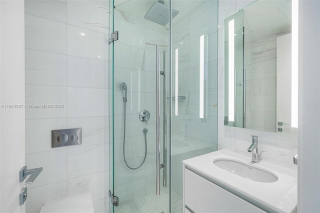 300 Biscayne Blvd Way Unit 2501, Miami, FL 33131 - bathroom with a stall shower, vanity, and tile walls