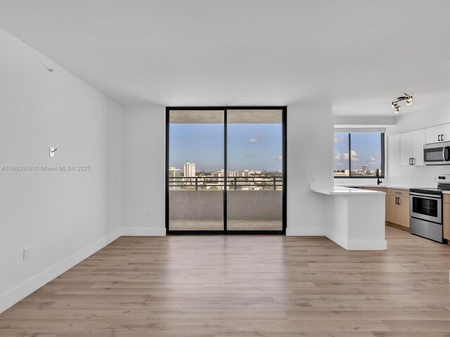 view of patio / terrace featuring a balcony, a water view, and an outdoor hangout area