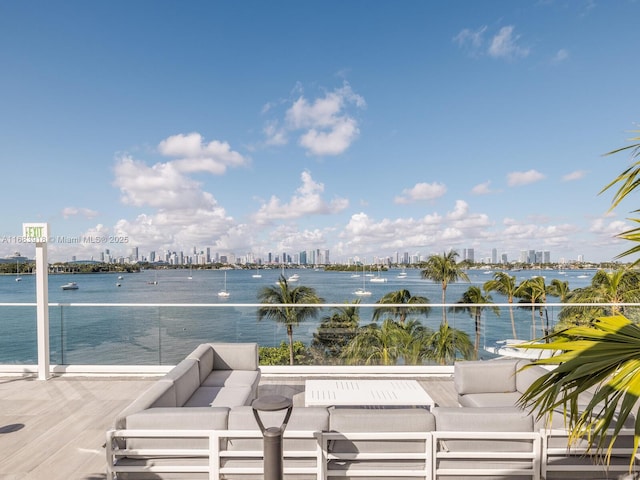 exterior space with a water view, a view of city, and an outdoor living space