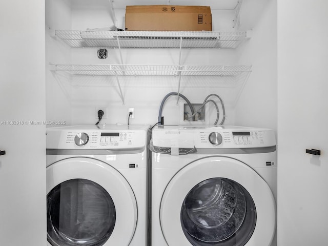washroom with laundry area and independent washer and dryer