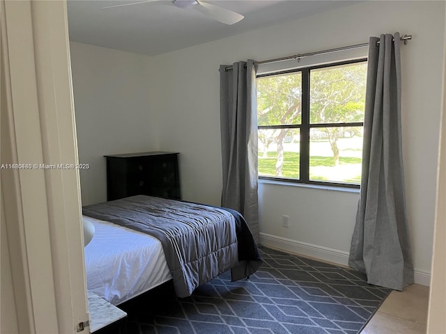 tiled bedroom with ceiling fan