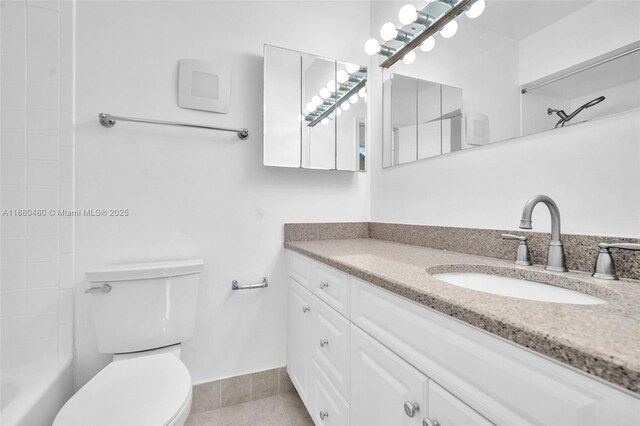 bathroom with tile patterned floors, vanity, and toilet