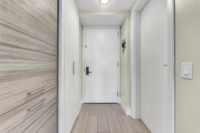 hall with light hardwood / wood-style floors