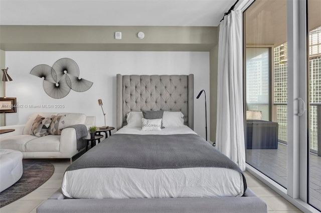 bedroom with light tile patterned floors and access to exterior