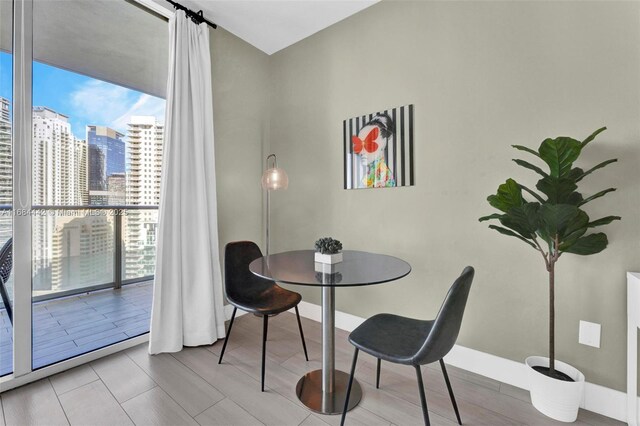 dining room featuring a wall of windows