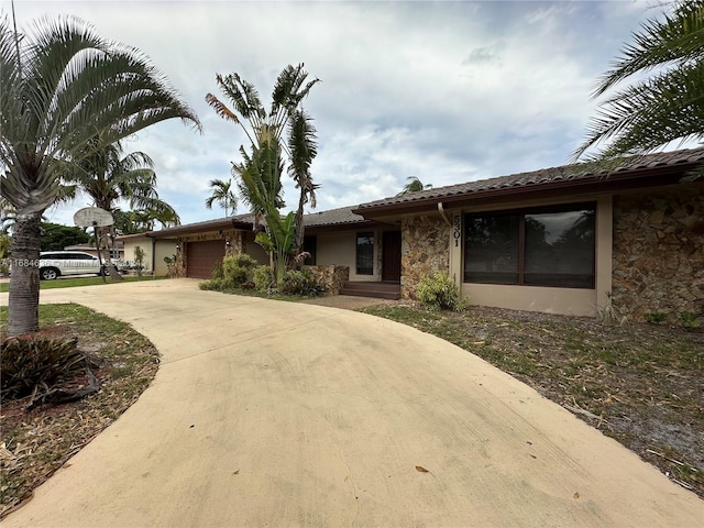 ranch-style house featuring a garage