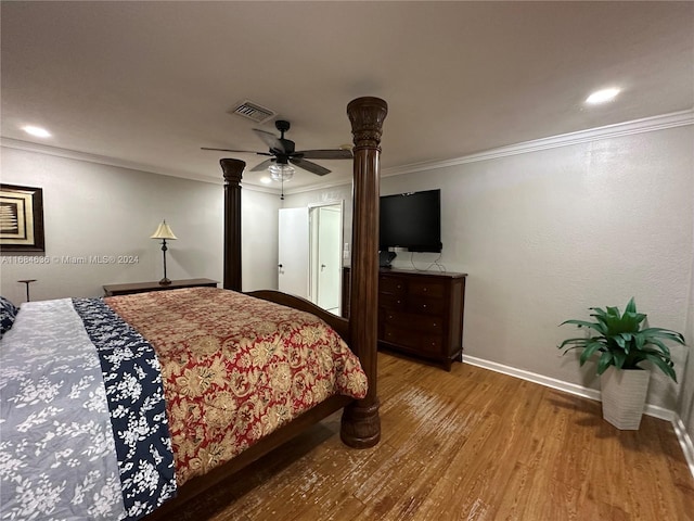 bedroom featuring crown molding, wood-type flooring, and ceiling fan