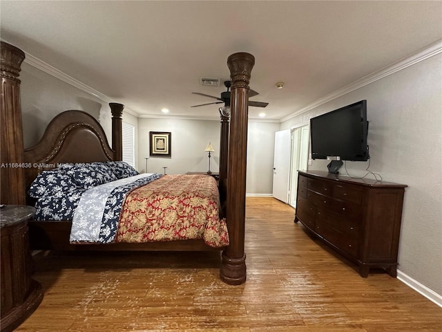 bedroom featuring ceiling fan, crown molding, and light hardwood / wood-style flooring