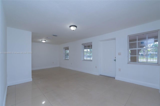 view of tiled spare room