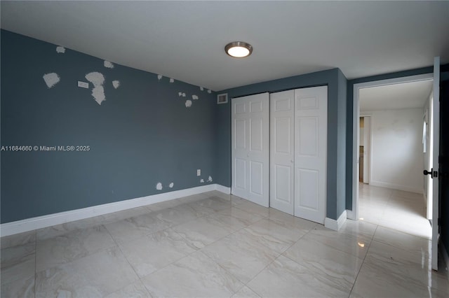 unfurnished bedroom featuring a closet