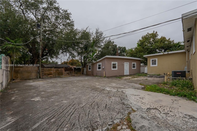 view of side of property featuring central AC unit