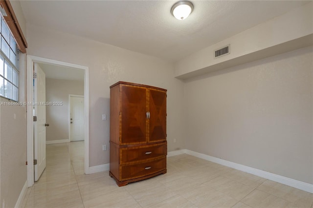 interior space with a textured ceiling