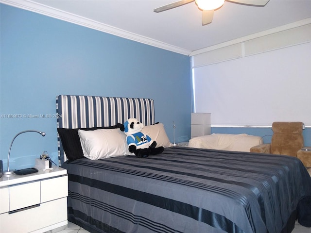 bedroom with ceiling fan and crown molding