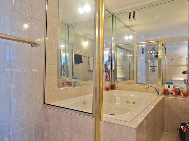 bathroom featuring a shower stall, visible vents, crown molding, and a tub with jets