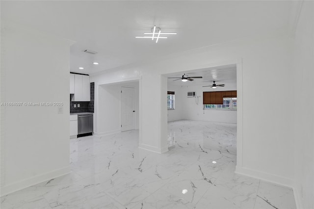 unfurnished living room with crown molding