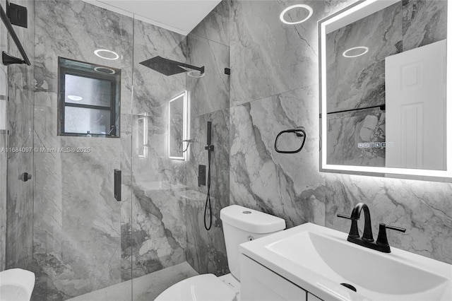 bathroom featuring vanity, a shower with shower door, tile walls, and toilet