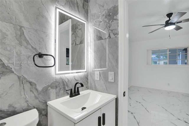 bathroom featuring vanity, a shower with shower door, tile walls, and toilet