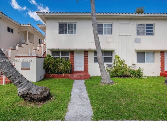 view of front of property with a front lawn